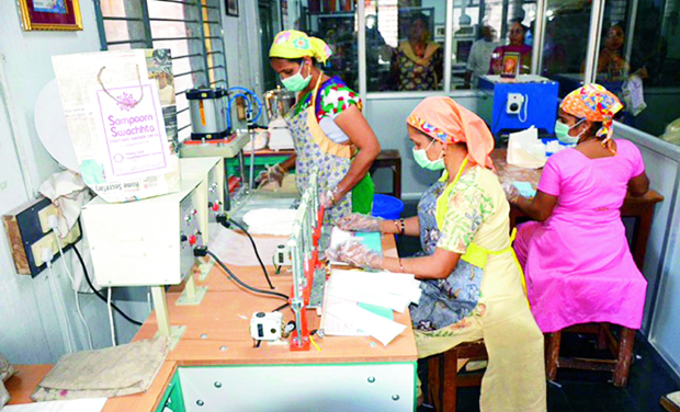 Physically handicapped women making the pads. (Photo: DC) Physically handicapped women making the pads. (Photo: DC)